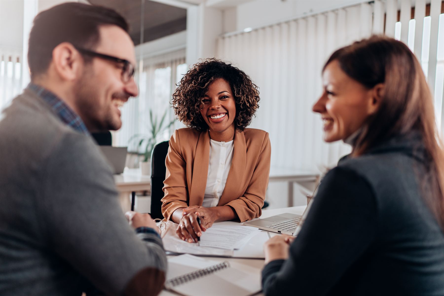 A couple meeting with an advisor at a table